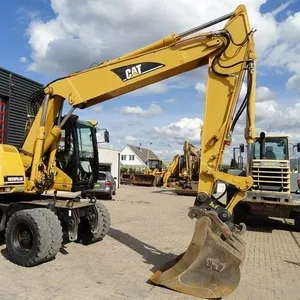 Caterpillar M316C — колесный экскаватор